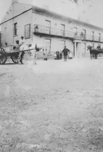 Batemans Brewery - shows an old black and white picture of the brewery with a horde drawn carriage in front of it from 100 years ago.