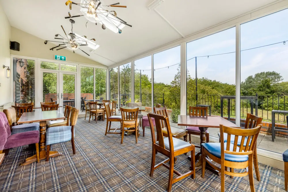 Batemans Pub - The Fairways, Brinsworth - Conservatory Seating with Golf Course View