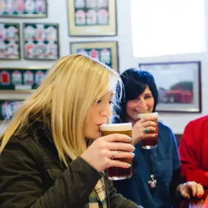 Woman drinking pint