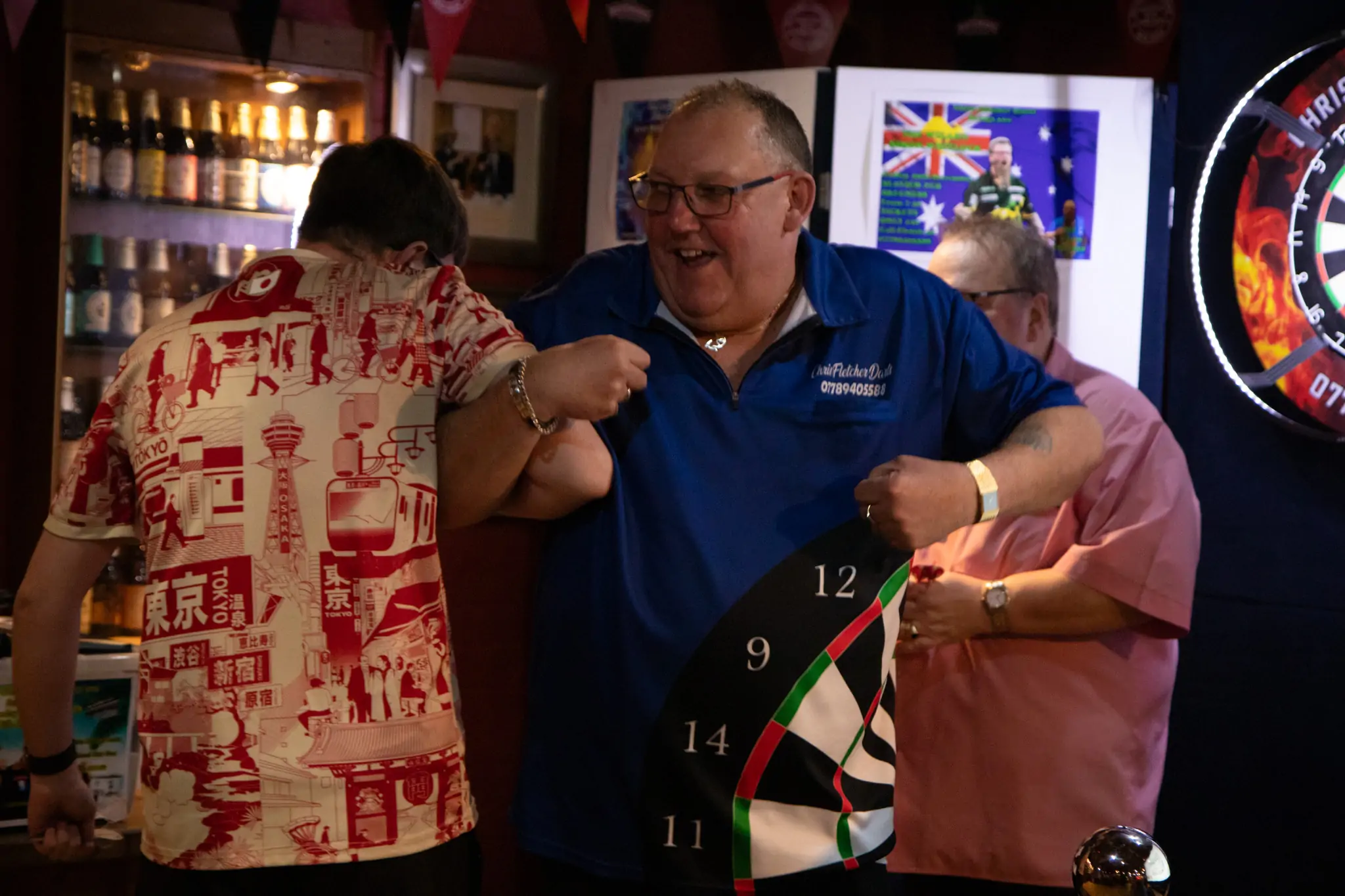Peter Manley Pro Darts Player at the Batemans 150th anniversary celebrations darts, Chris Fletcher dancing with one of the competitors.