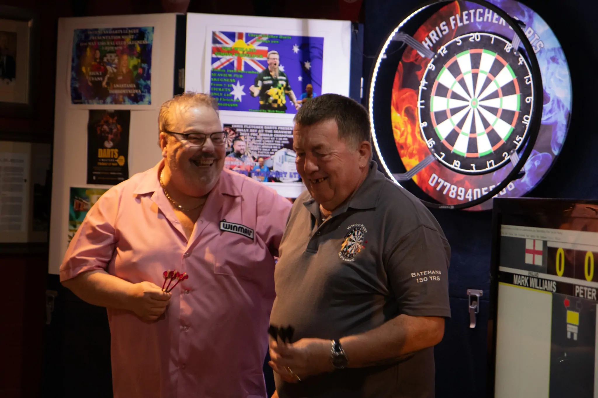 Peter Manley Pro Darts Player at the Batemans 150th anniversary celebrations darts with one of the competitors Mark Williams landlord from The White Hart, Old Leake