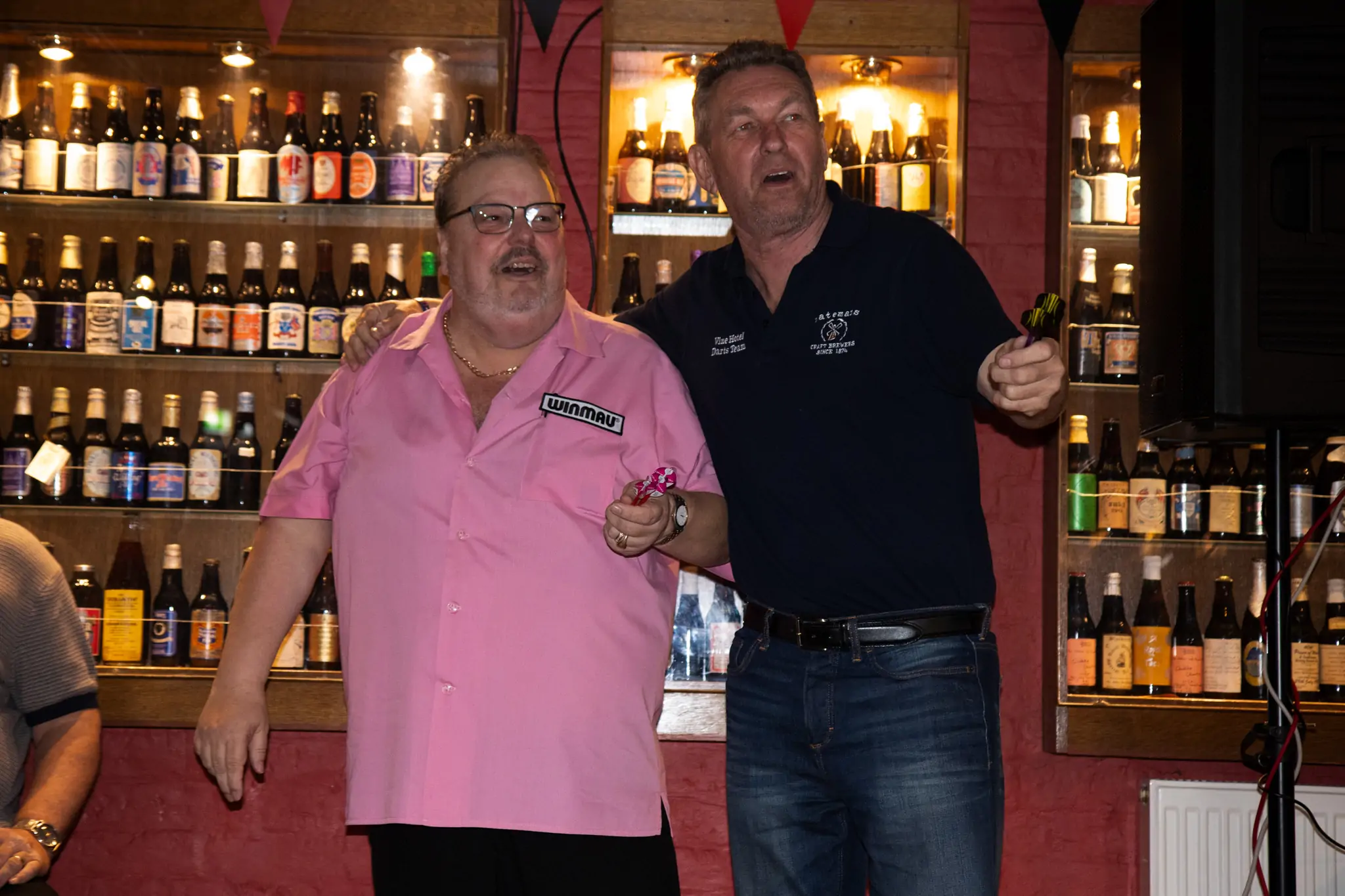 Peter Manley Pro Darts Player at the Batemans 150th anniversary celebrations darts with one of the competitors Miles Hartley.