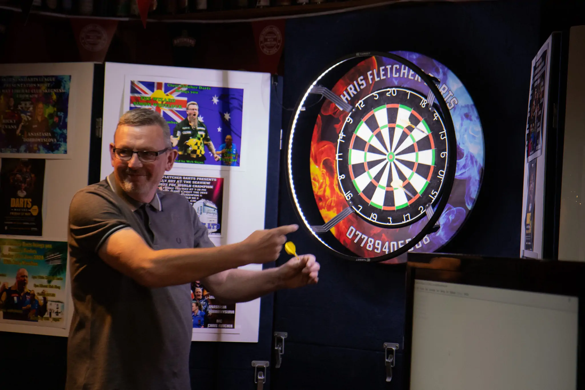 Peter Manley Pro Darts Player at the Batemans 150th anniversary celebrations darts with one of the competitors Martin Bell.